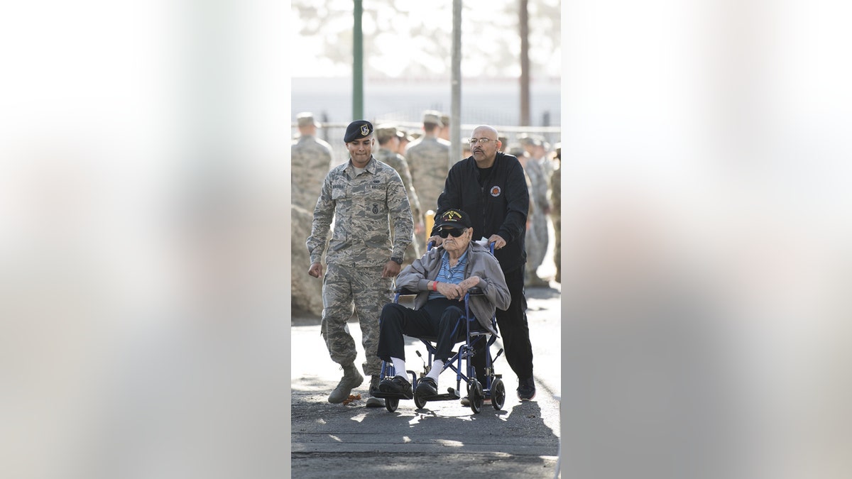 Airman 1st Class Jonathan Realegeno accompanied a veteran last month during the Stand Down. (U.S. Air Force photo by Airman 1st Class Hanah Abercrombie)