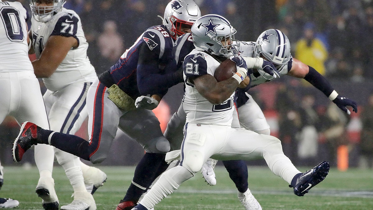 Dallas Cowboys running back Ezekiel Elliott carries the ball as New England Patriots linebacker Jamie Collins, left, gives chase in the first half of an NFL football game, Sunday, Nov. 24, 2019, in Foxborough, Mass. (AP Photo/Elise Amendola)