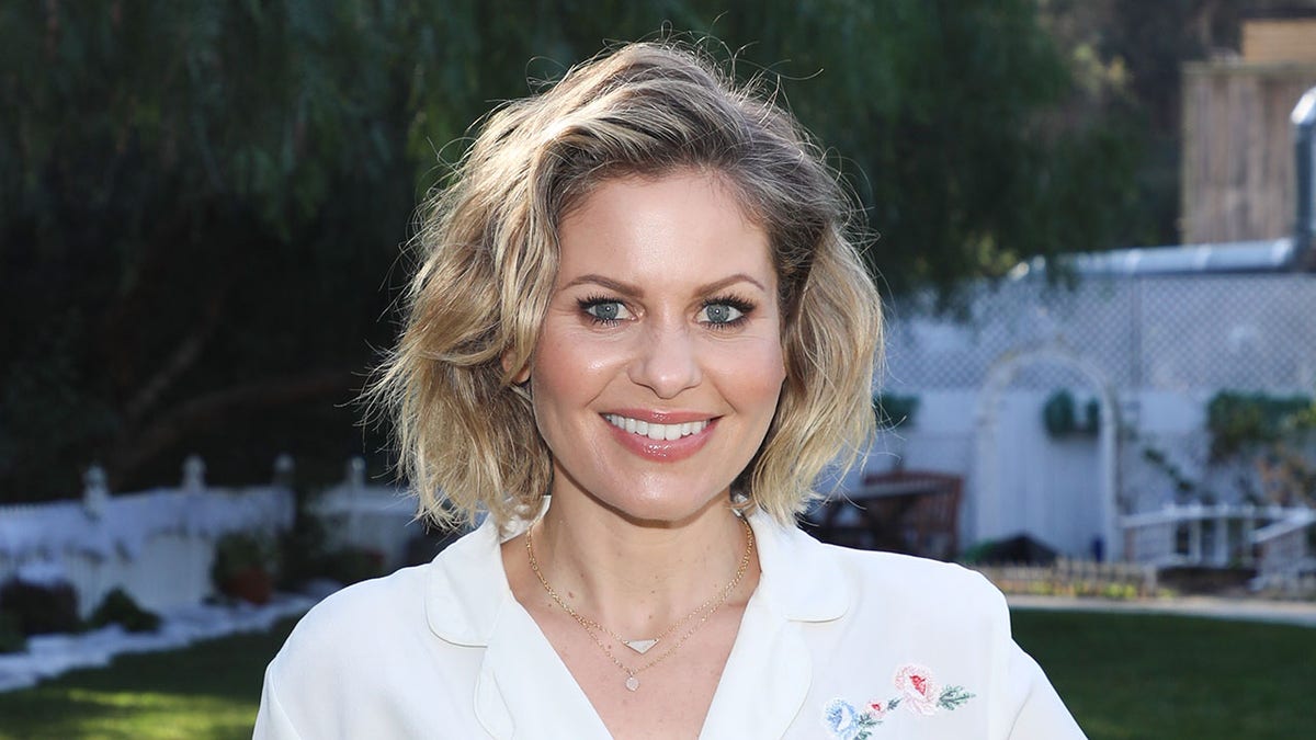 Candace Cameron Bure asked critics on social media to 'do better' in 2021 after responding to backlash for her family photo.