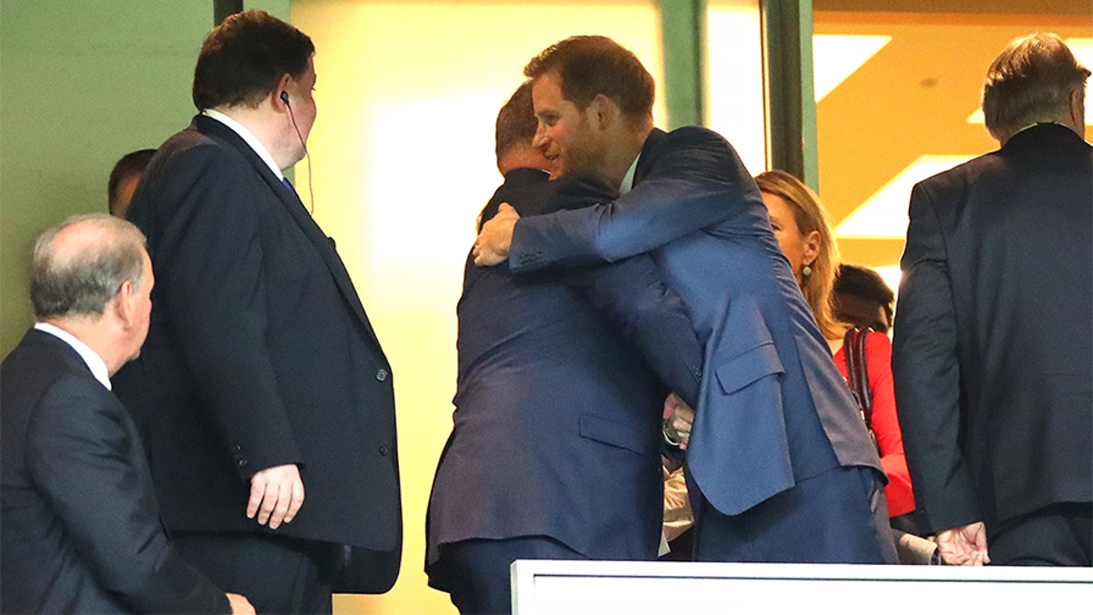 Prince Harry, Duke of Sussex (R) embraces Albert II, Prince of Monaco (L) in the stands during the Rugby World Cup 2019 Final between England and South Africa at International Stadium Yokohama on November 02, 2019 in Yokohama, Kanagawa, Japan.