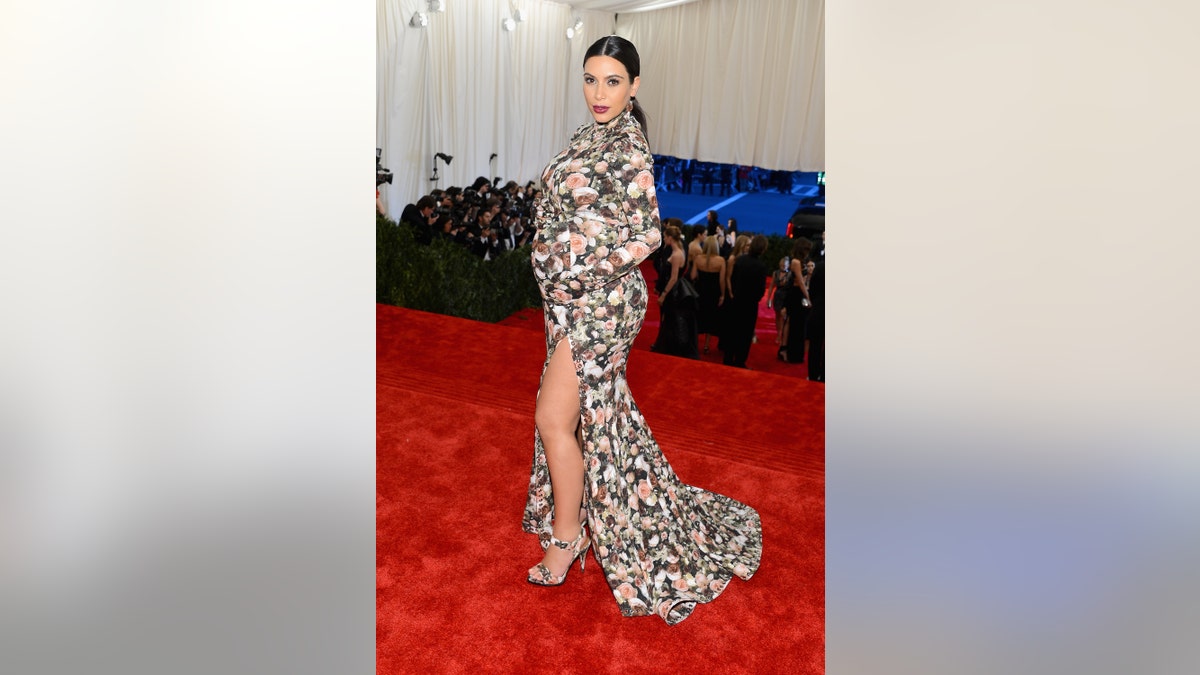 Kim Kardashian invites wardrobe malfunction in vintage gown