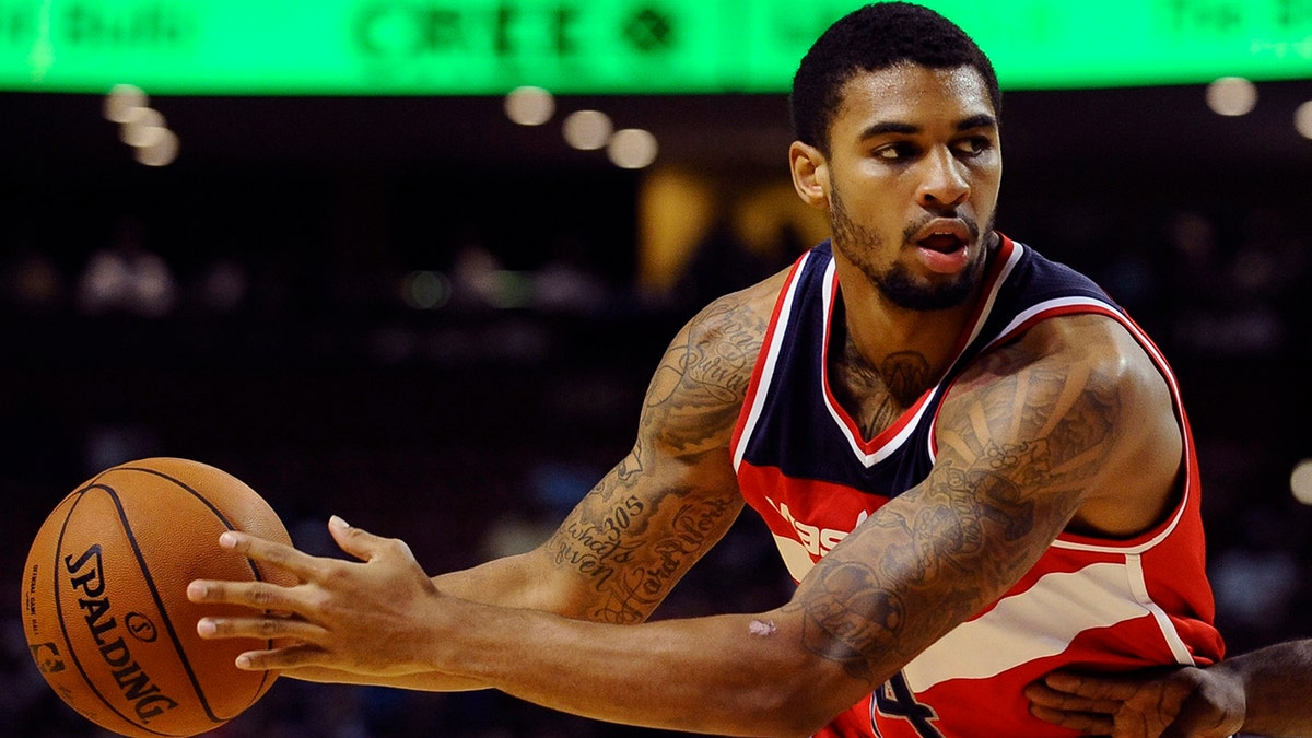 FILE - In this Oct. 10, 2014, file photo, Washington Wizards guard Glen Rice Jr. (14) looks to score during the first half of a preseason NBA basketball game against Charlotte Hornets in Greenville, S.C. Former Washington Wizards guard Glen Rice Jr. pleaded not guilty to a single charge of injuring with intent when he appeared in an Auckland court on Wednesday, Nov. 20, 2019. (AP Photo/Rainier Ehrhardt, File)