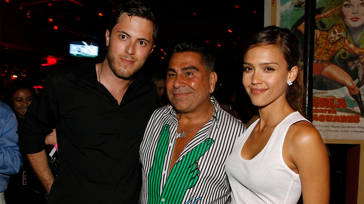 Harry Morton, left, Luis Barajas, the founder of Flaunt magazine, and Jessica Alba at the opening of a Pink Taco restaurant in Los Angeles, in 2007.  (AP Photo/Chris Polk, File)