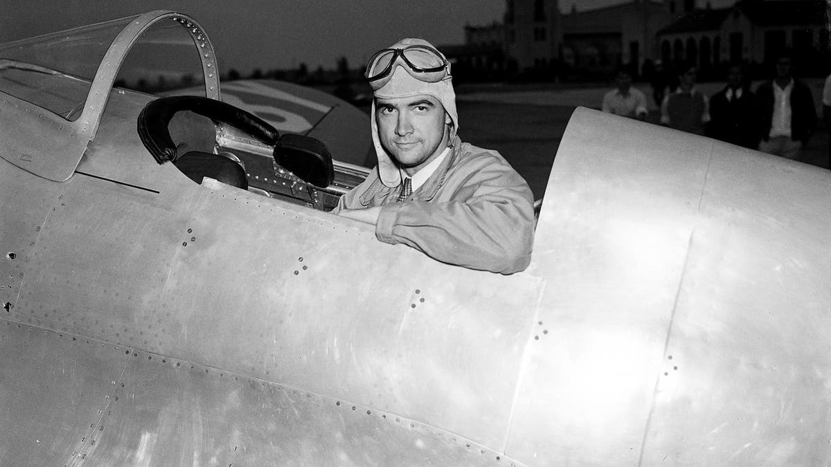 Howard Hughes, industrialist, film producer and pilot, poses in the cockpit of his new racing plane after a test flight in Los Angeles August 17, 1935. The plane, nearly two years in construction at a cost believed to be more than $100,000, was to be piloted by Hughes in the Bendix race from Los Angeles to Cleveland. (AP Photo)