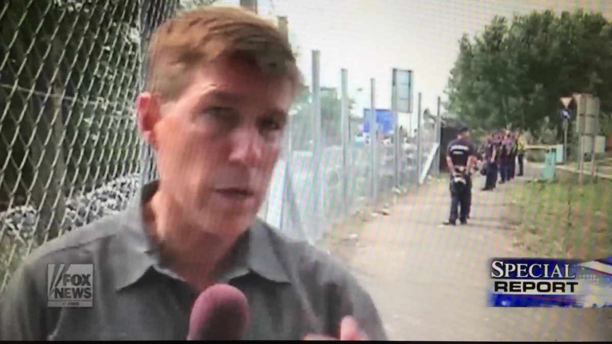 Greg Palkot covering migrants in Roszke, in the Hungary-Serbia border.