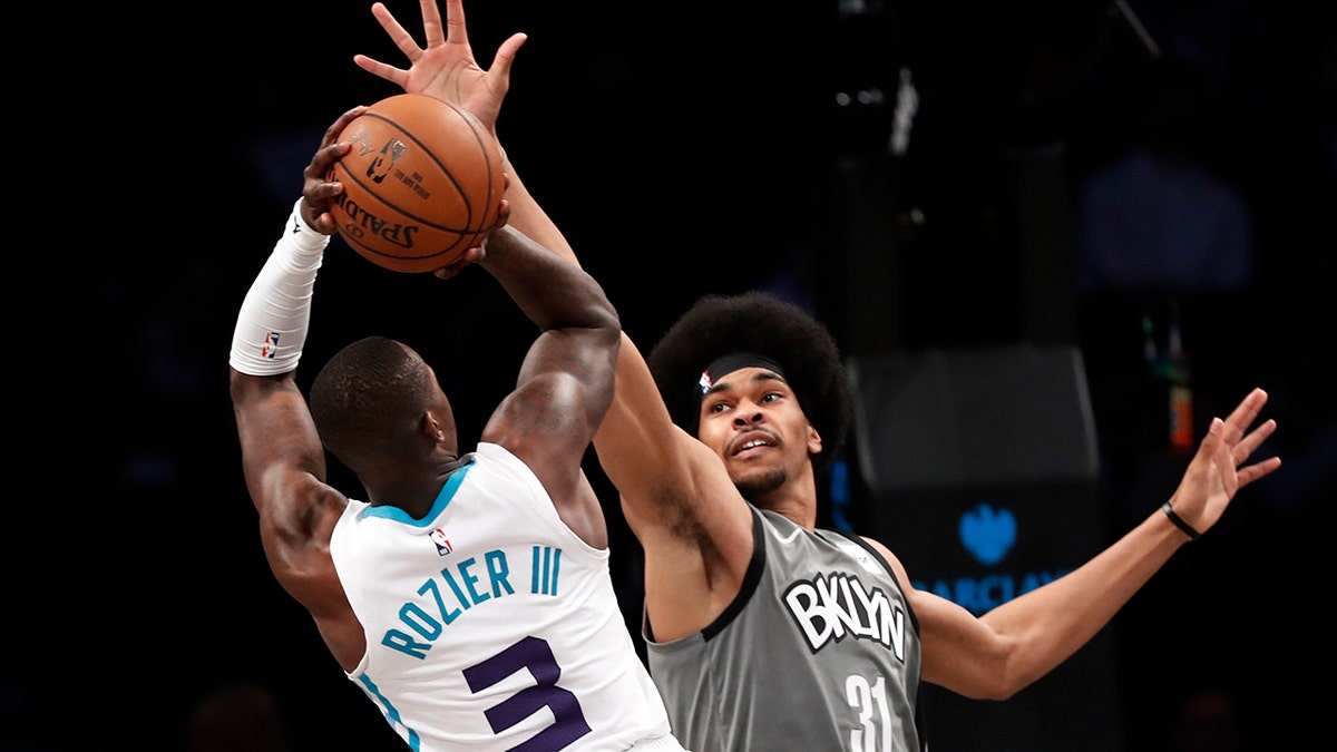 Brooklyn Nets center Jarrett Allen (31) defends against Charlotte Hornets guard Terry Rozier (3) during the second half of an NBA basketball game Wednesday, Nov. 20, 2019, in New York. The Nets won 101-91. (AP Photo/Kathy Willens)