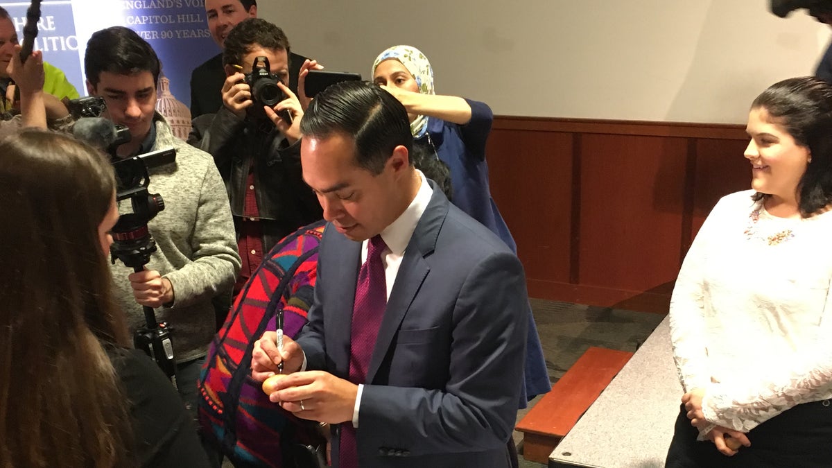 Democratic presidential candidate Julian Castro signs the famed wooden eggs as he headlines 'Politics and Eggs' at the New Hampshire Institute of Politics in Manchester, NH in January, 2019