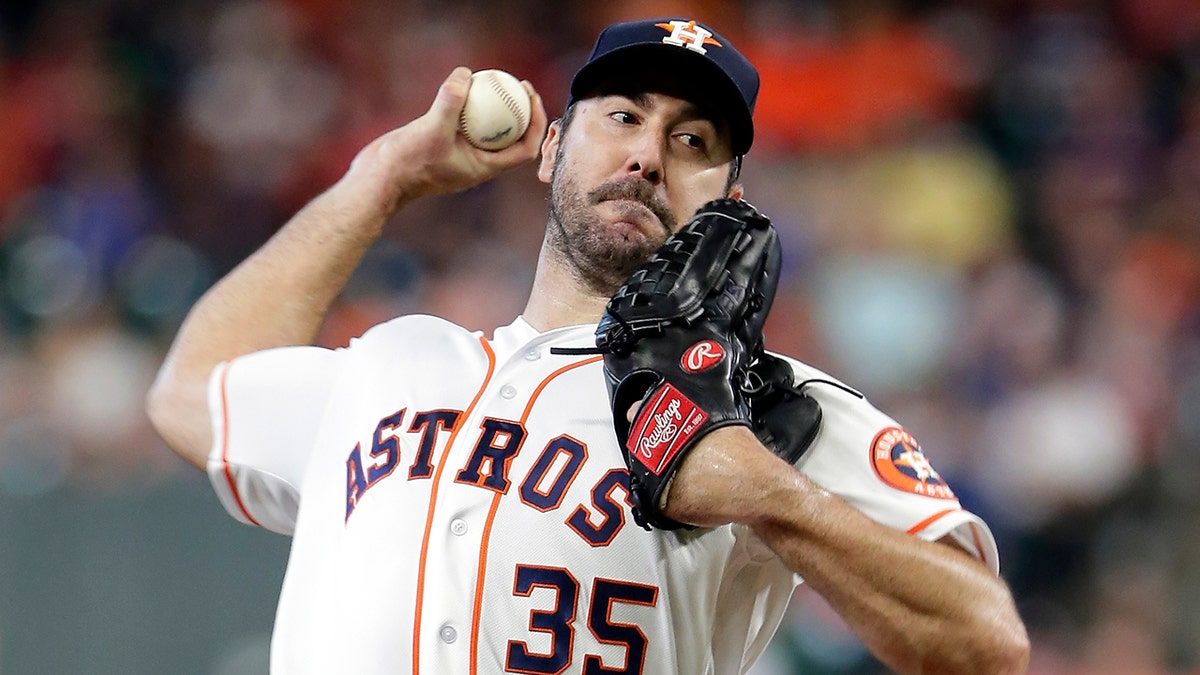FILE - In this July 24, 2019, file photo, Houston Astros starting pitcher Justin Verlander throws to an Oakland Athletics batter during a baseball game in Houston. Verlander has been awarded his second AL Cy Young Award. (AP Photo/Michael Wyke, File)