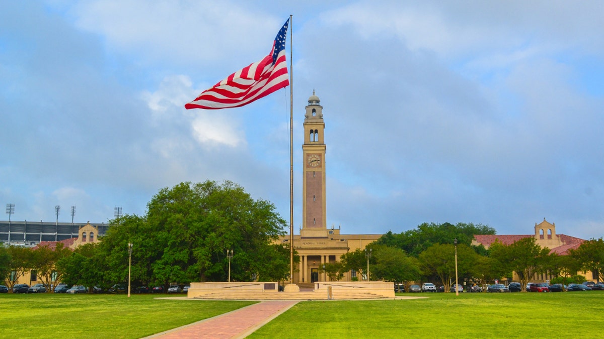 building and flag on LSU campus