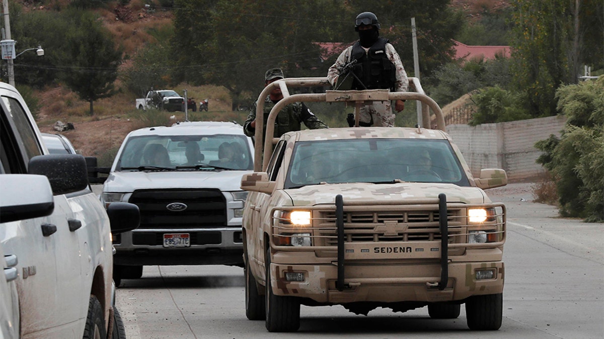 Soldiers patrol La Mora ahead of the funeral Thursday. (AP Photo/Marco Ugarte)