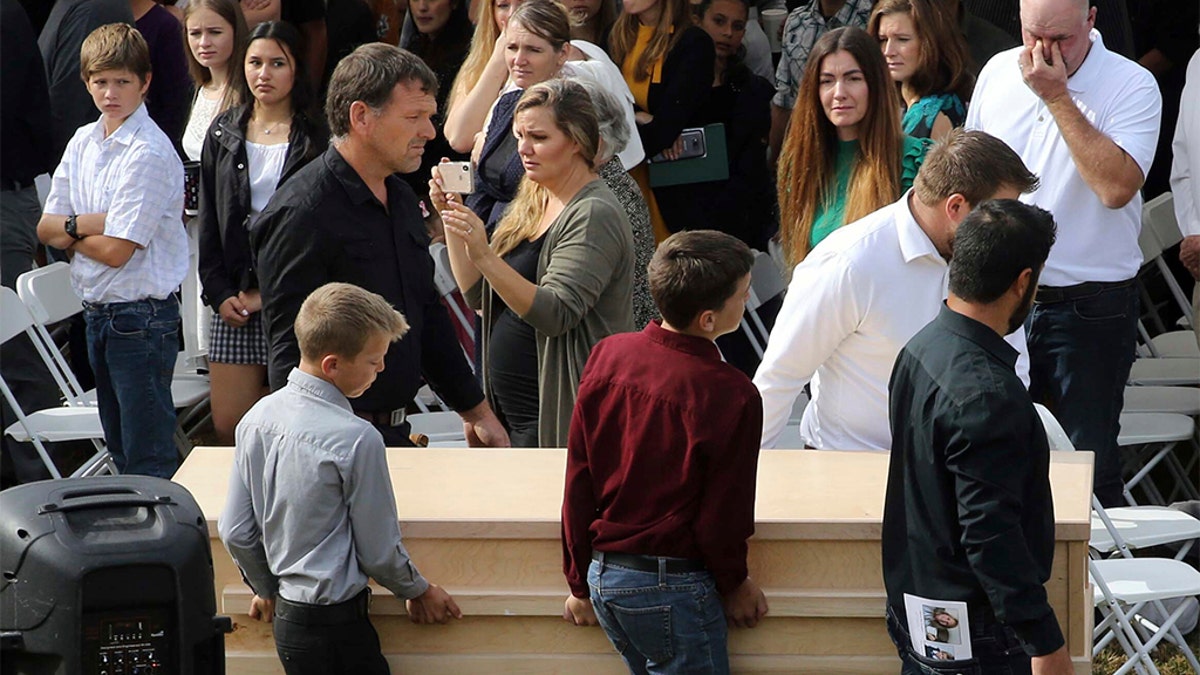 Youths and men carried a coffin during Thursday's funeral. (AP Photo/Marco Ugarte)