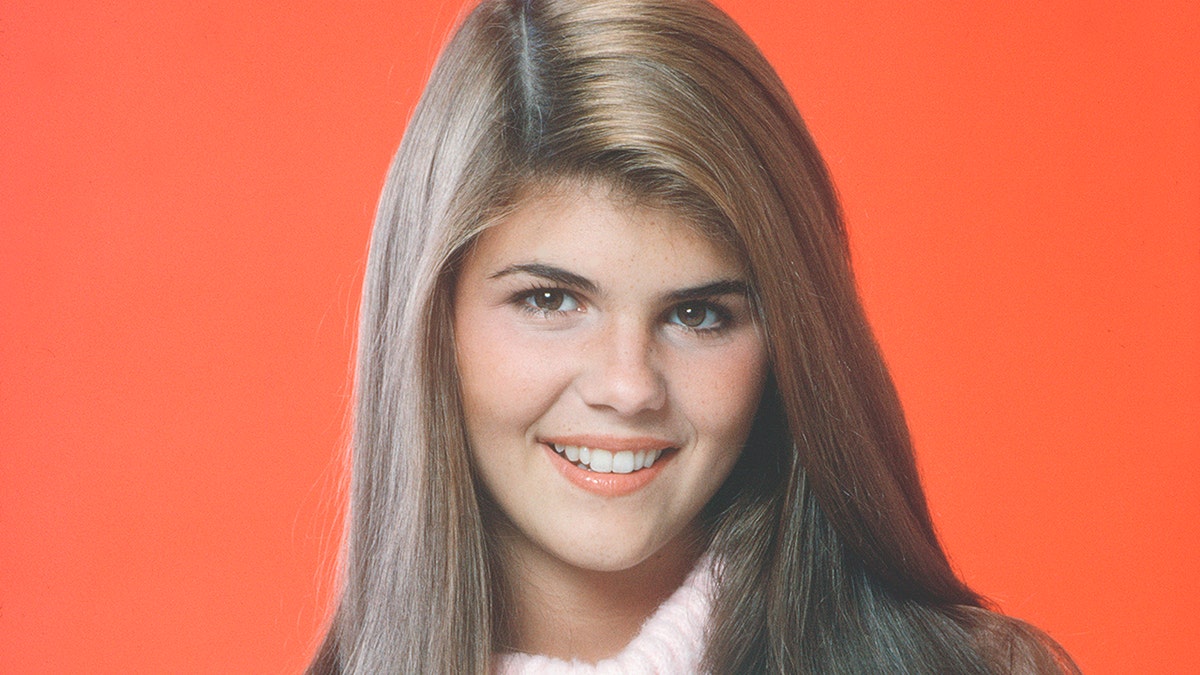 Lori Loughlin, pictured here in 1982, looks just like her daughter, Bella, in a new throwback picture. 