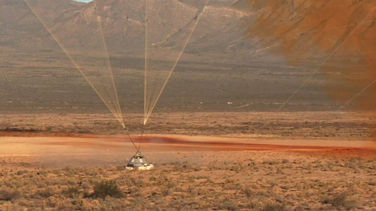 The Starliner capsule lands in the New Mexico desert. (Image credit: NASA TV)
