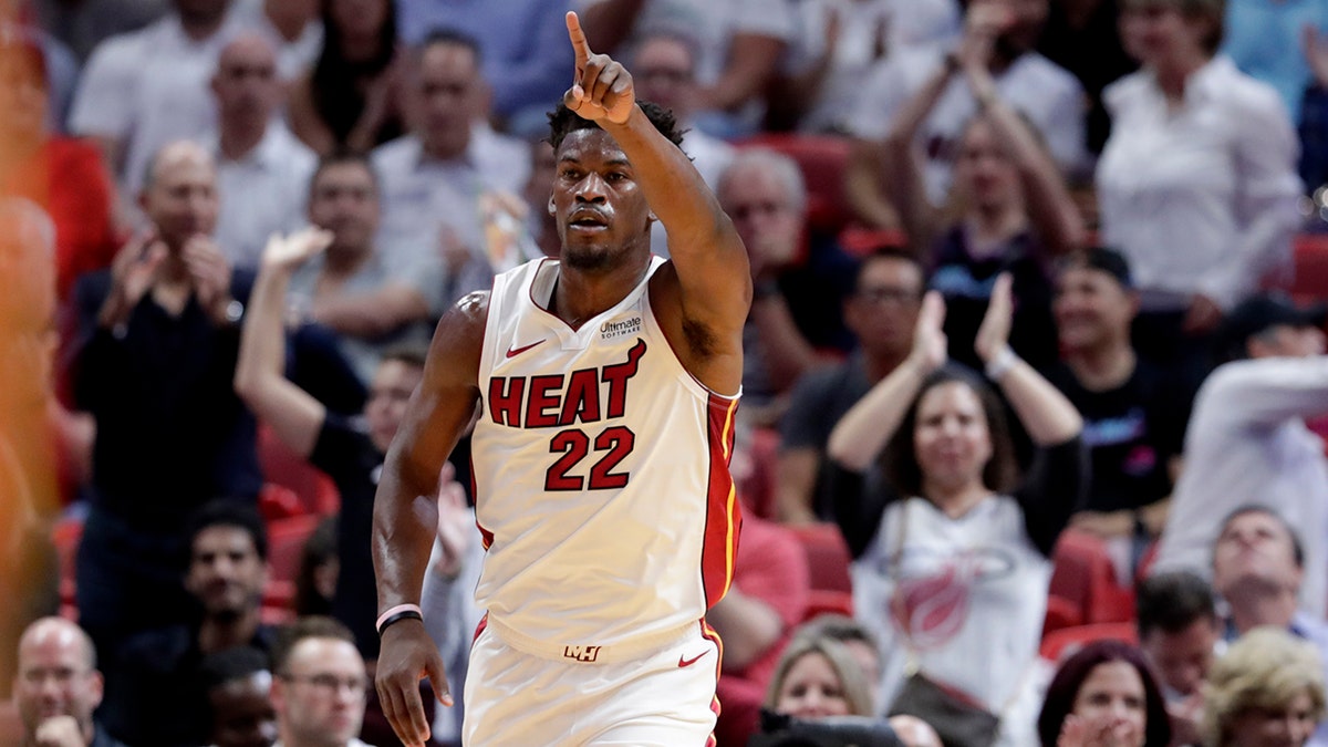 Miami Heat forward Jimmy Butler (22) dunks as Brooklyn Nets guard