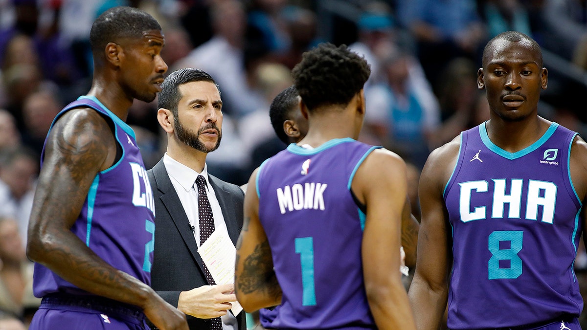 Charlotte Hornets coach James Borrego huddles with his team during a break in the first half of the team's NBA basketball game against the Boston Celtics in Charlotte, N.C., Thursday, Nov. 7, 2019. 