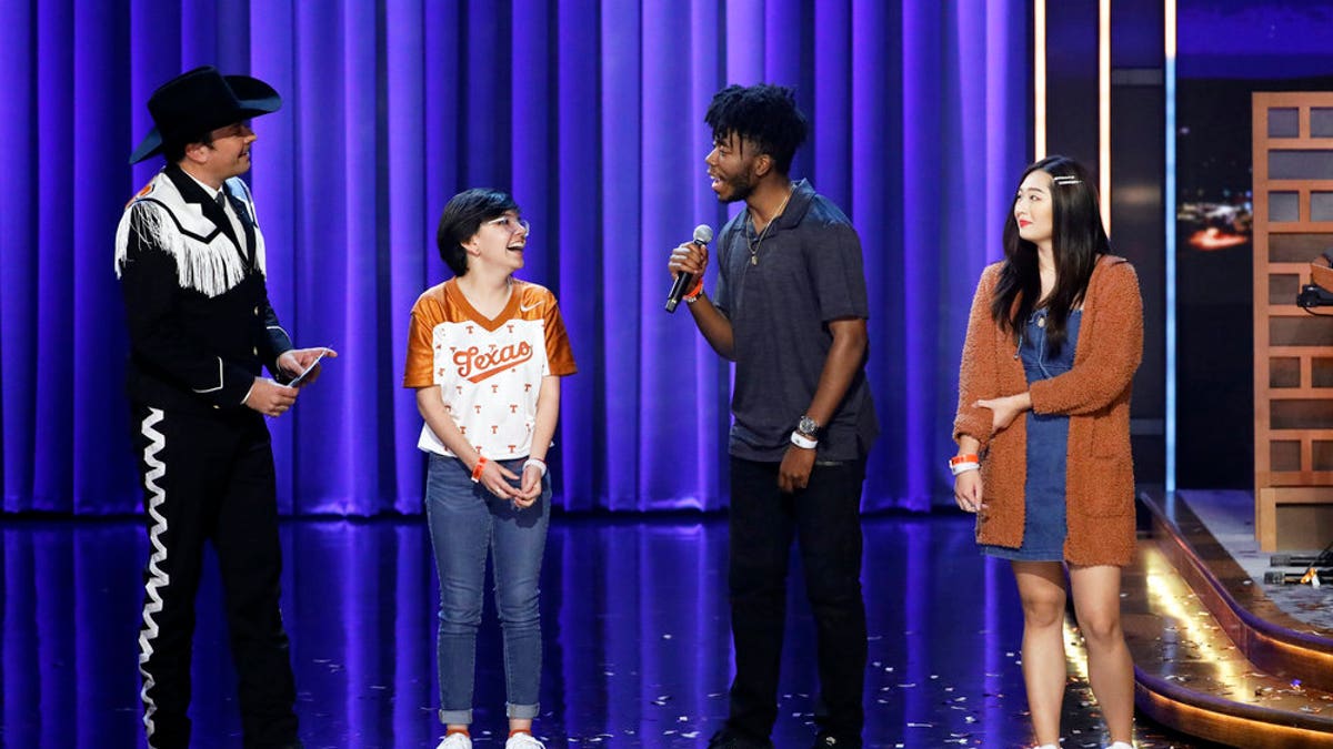 Jimmy Fallon with UT Austin students Alma Zamora (left), Fitzgerald Alan (middle) and Elizabeth Yoon (right) during the "Samsung Phone Giveaway."