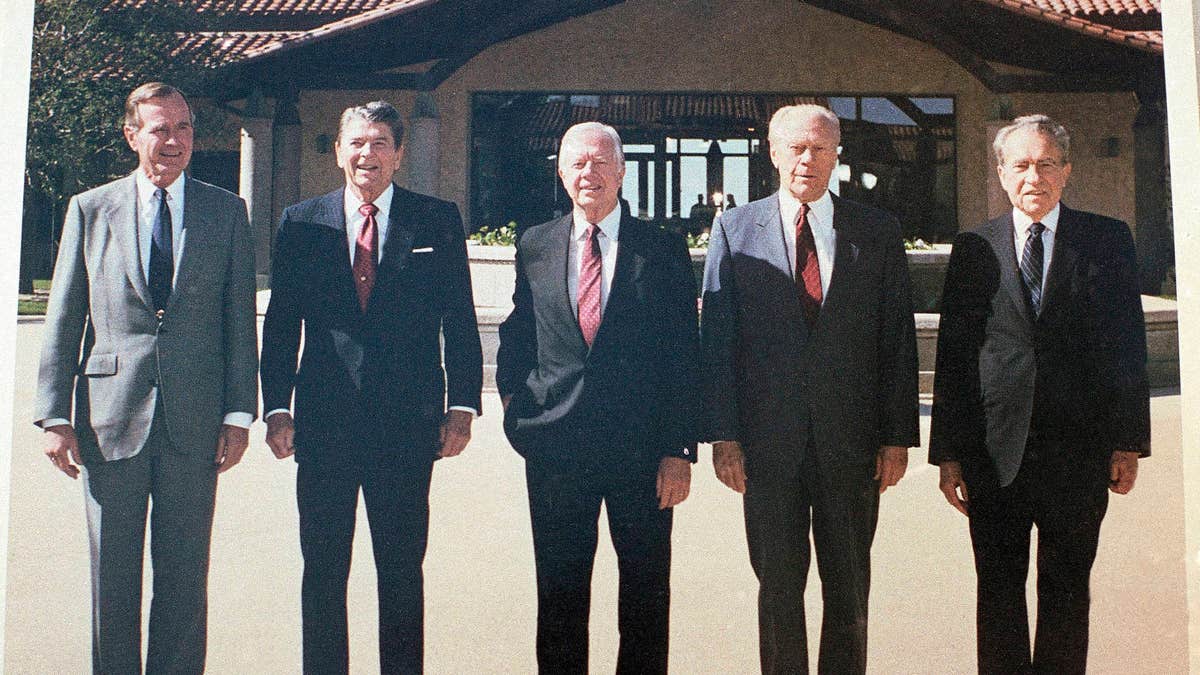 Former Presidents, from left, George H. W. Bush, Ronald Reagan, Jimmy Carter, Gerald Ford and Richard Nixon in the courtyard during the dedication of the Ronald Reagan Presidential Library in Simi Valley, Calif., on Nov. 4, 1991. (AP Photo/Marcy Nighswander)