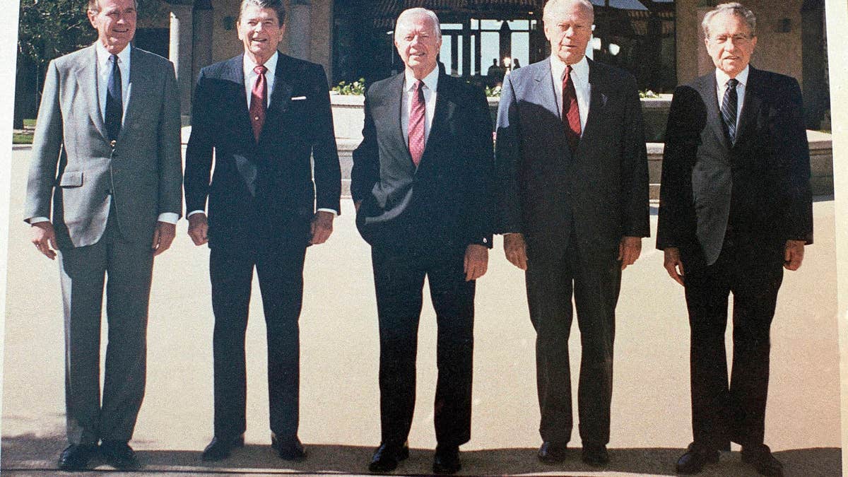 Former Presidents, from left, George H. W. Bush, Ronald Reagan, Jimmy Carter, Gerald Ford and Richard Nixon in the courtyard during the dedication of the Ronald Reagan Presidential Library in Simi Valley, Calif., on Nov. 4, 1991. (AP Photo/Marcy Nighswander)