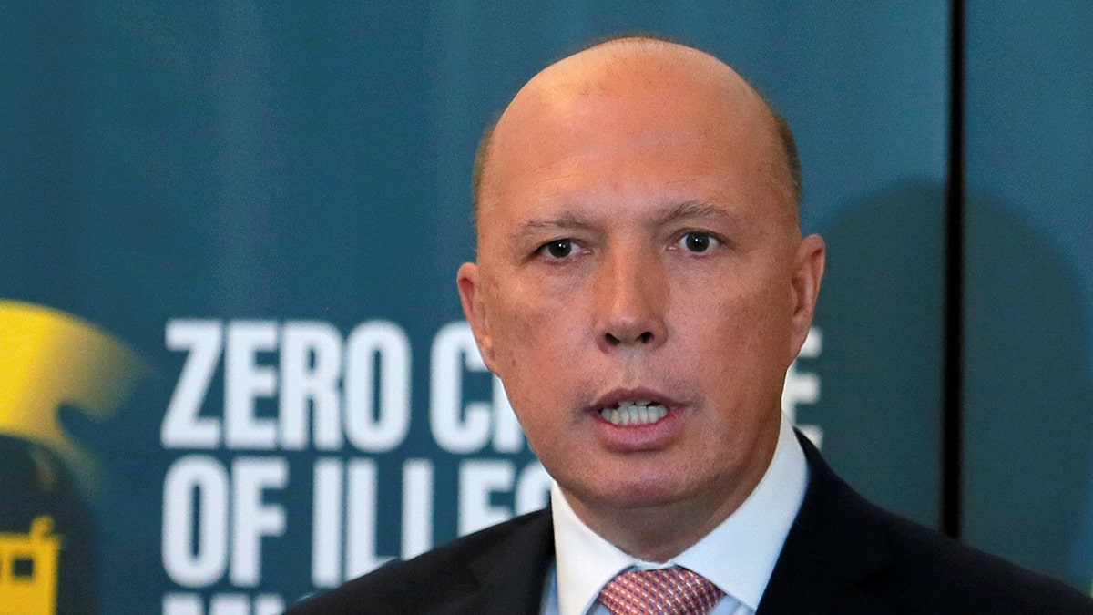 Australian Minister of Home Affairs Peter Dutton speaks next to Sri Lanka's Navy Commander Piyal De Silva during a news conference in Colombo, Sri Lanka June 4, 2019. REUTERS/Dinuka Liyanawatte - RC1550B96A70