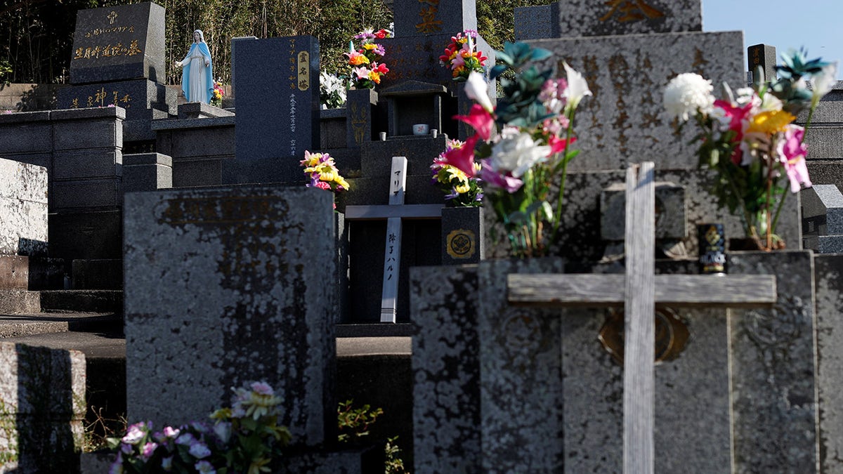 A statue of Virgin Mary is seen on a gravestone of descendants of 'Hidden Christians' who preserved their faith in secret during centuries of persecution, at a cemetery on Ikitsuki Island, Nagasaki Prefecture, Japan, November 6, 2019. REUTERS/Issei Kato