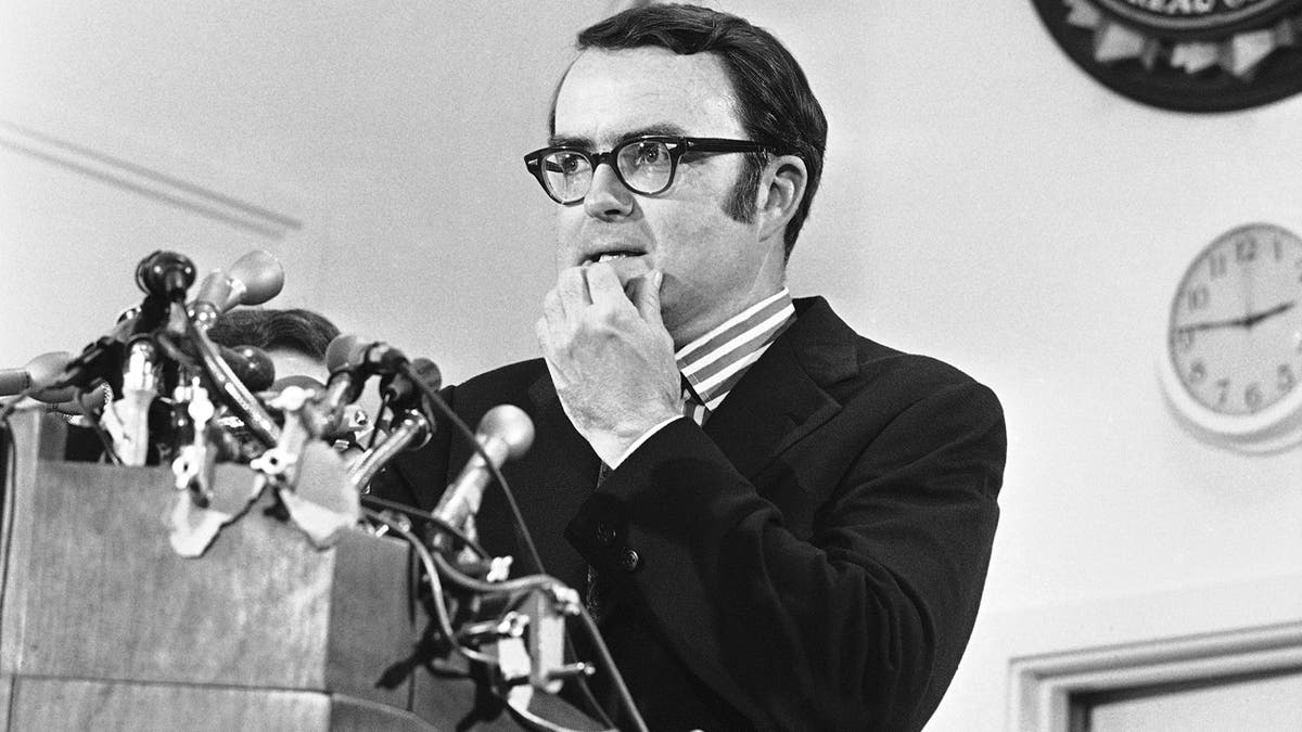 Then-acting FBI director William Doyle Ruckelshaus pauses during a news conference in May 1973. (AP Photo/Charles Gorry)