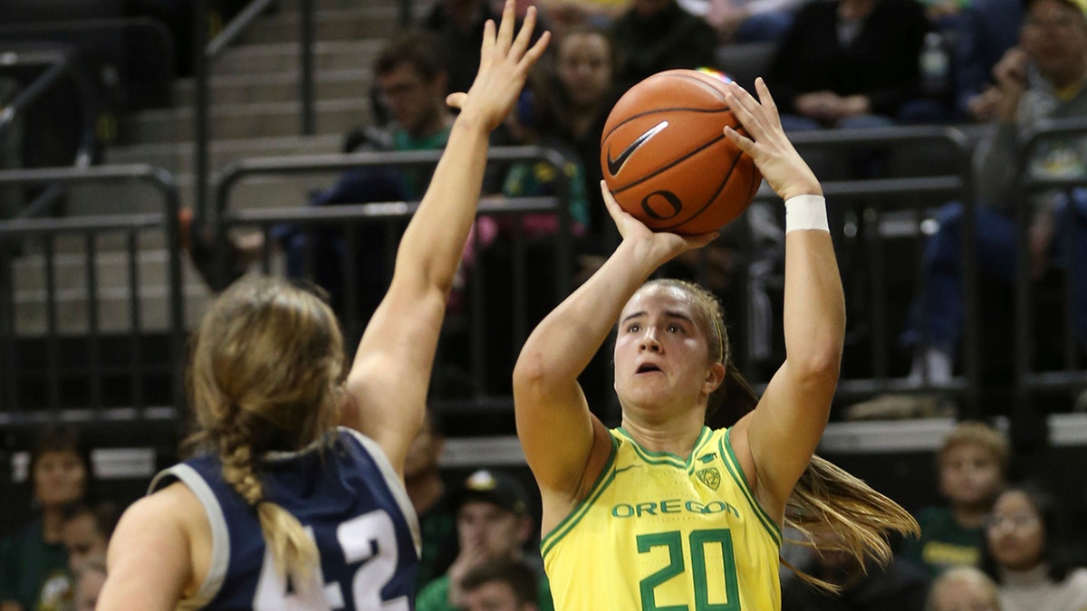 Oregon's Sabrina Ionescu, right, shots over Utah State's Taylor Franson during the second quarter of an NCAA college basketball game in Eugene, Ore., Wednesday, Nov. 13, 2019. (AP Photo/Chris Pietsch)