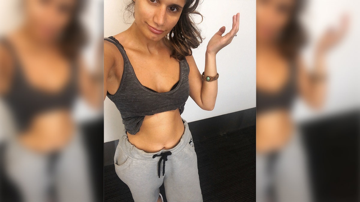 Serah Nathan claims she was "slut-shamed" for wearing a crop top and sweat pants (not pictured) while sitting on her boyfriend's knees. <br>