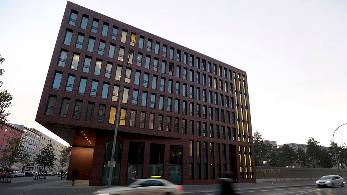 Cars drive past the center for advanced education (ZNAF) at the Federal Intelligence Service (BND) in Berlin Tuesday. (AP Photo/Michael Sohn)