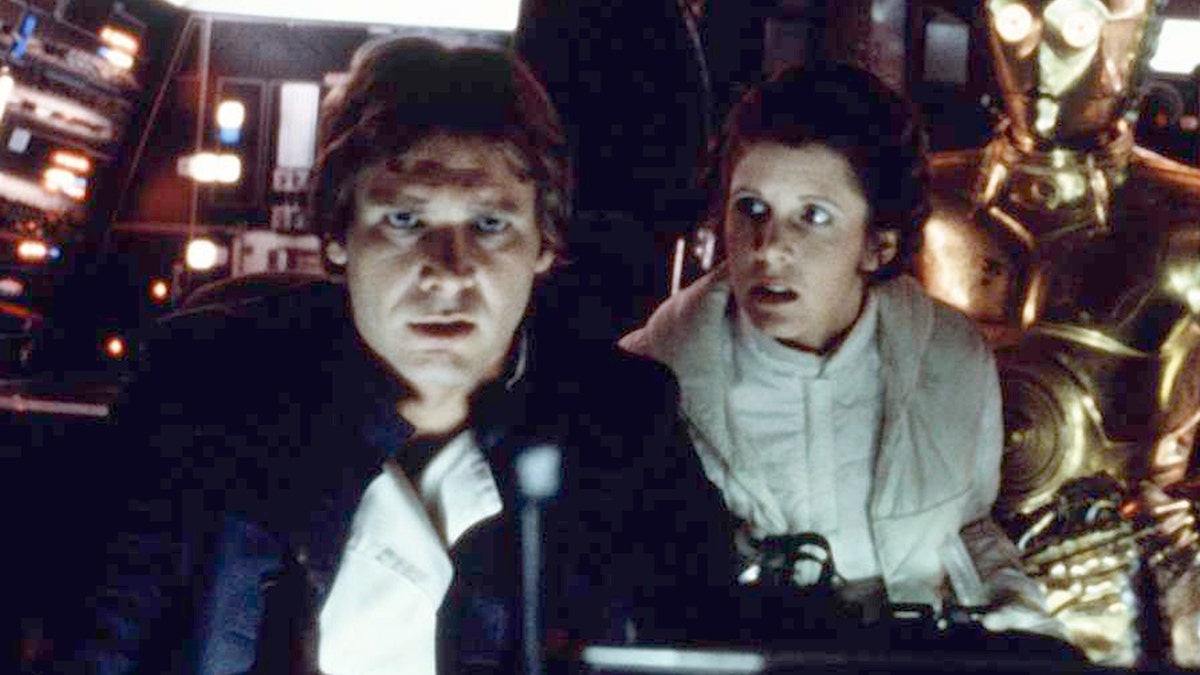 Harrison Ford and Carrie Fisher on the set of "Star Wars: Episode V - The Empire Strikes Back" directed by Irvin Kershner. 