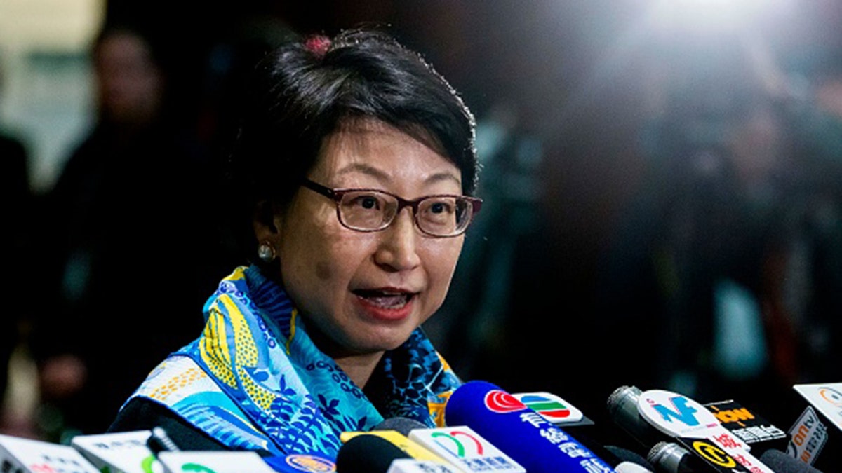 Hong Kong's justice secretary Teresa Cheng speaks to the media at the Legislative Council in Hong Kong on January 24, 2018, after answering lawmakers' questions about illegal structures found at some of the properties she owns. / AFP PHOTO / ISAAC LAWRENCE (Photo credit should read ISAAC LAWRENCE/AFP via Getty Images)