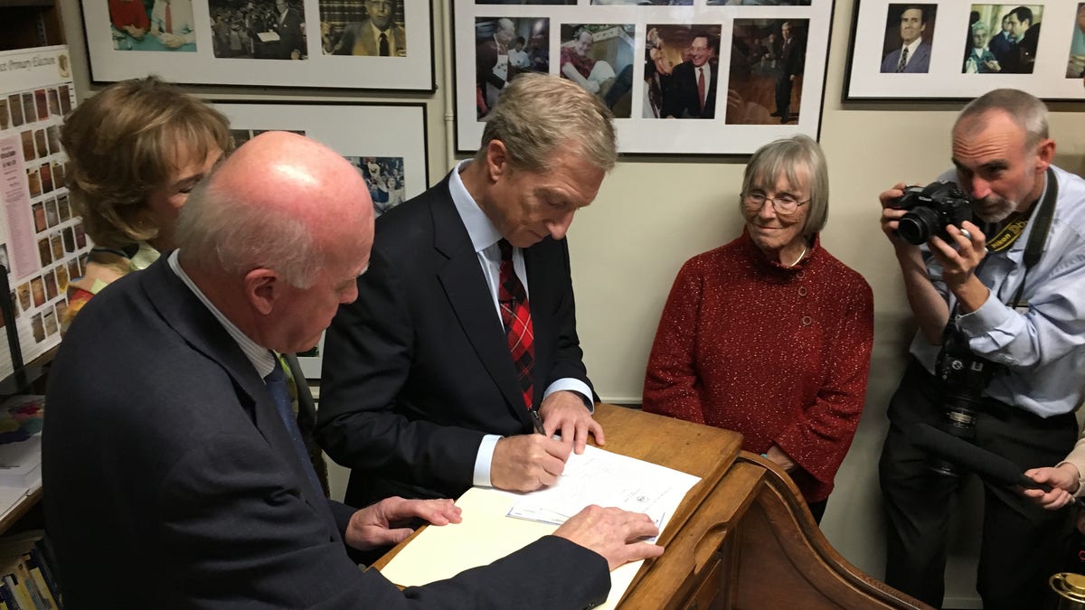 Tom Steyer files to place his name on New Hampshire's presidential primary ballot, at the Statehouse in Concord Tuesday.