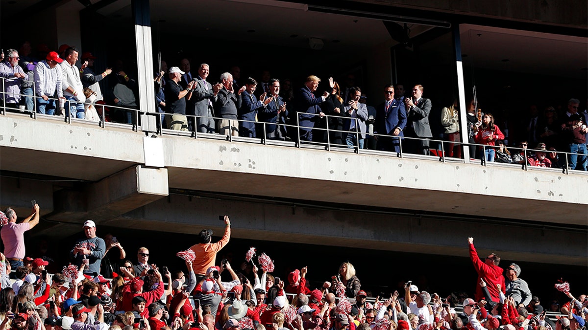 President Donald Trump and first lady Melania Trump attend Saturday's game between LSU and Alabama. (Photo by Kevin C. Cox/Getty Images)