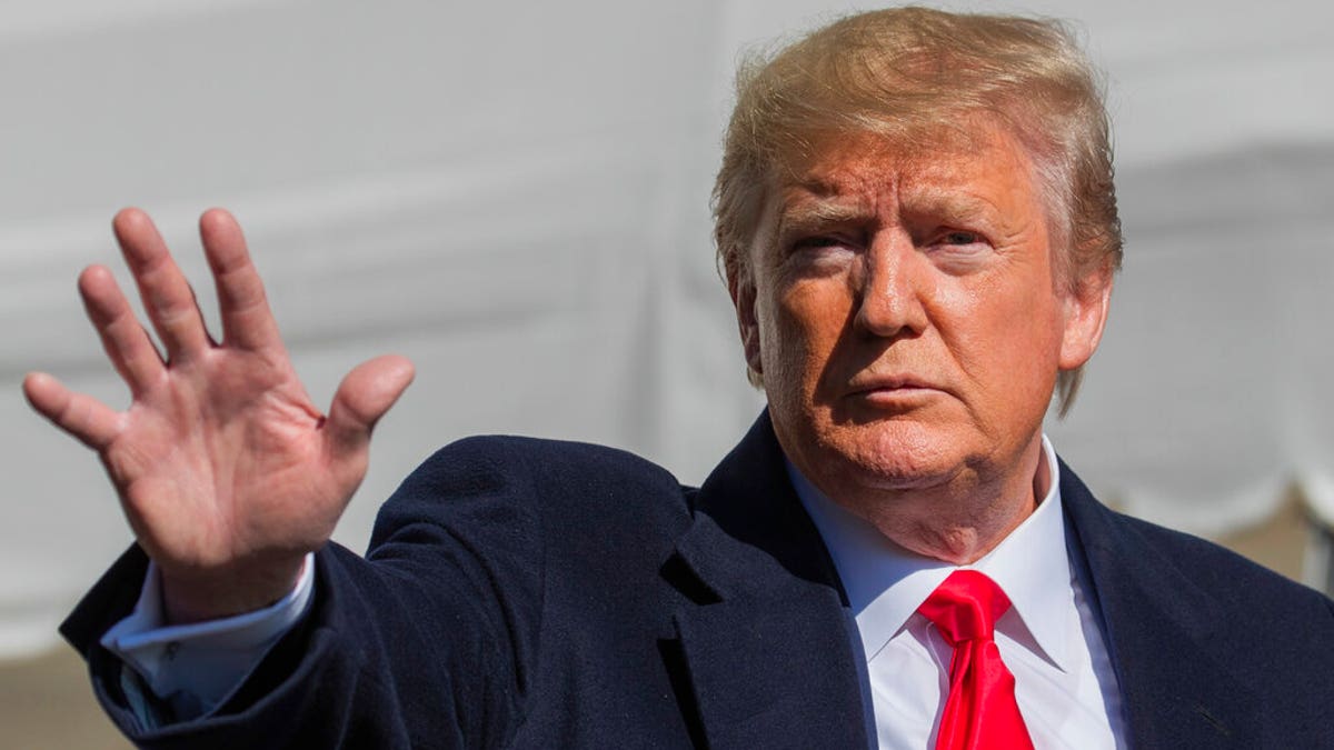 President Donald Trump waves after speaking to reporters upon arrival at the White House in Washington, Sunday, Nov. 3, 2019. (AP Photo/Manuel Balce Ceneta)