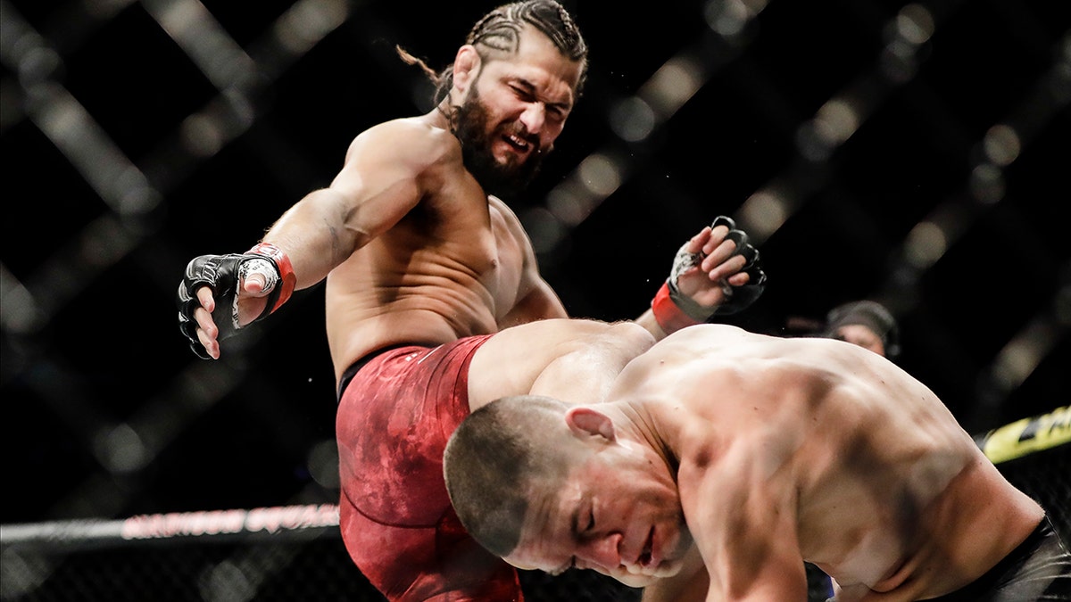 Jorge Masvidal, left, kicks Nate Diaz during the first round of a welterweight mixed martial arts bout at UFC 244 early Sunday, Nov. 3, 2019, in New York. (Associated Press)