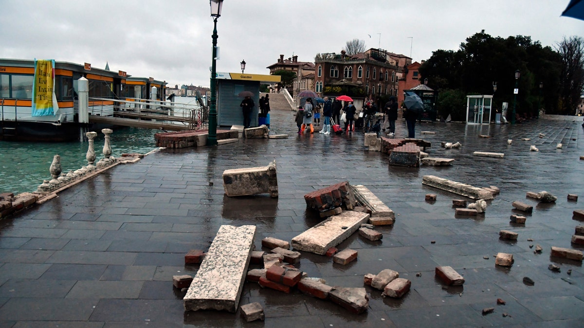 Parts of a dock lie damaged, in Venice, Italy, Wednesday, Nov. 13, 2019.
