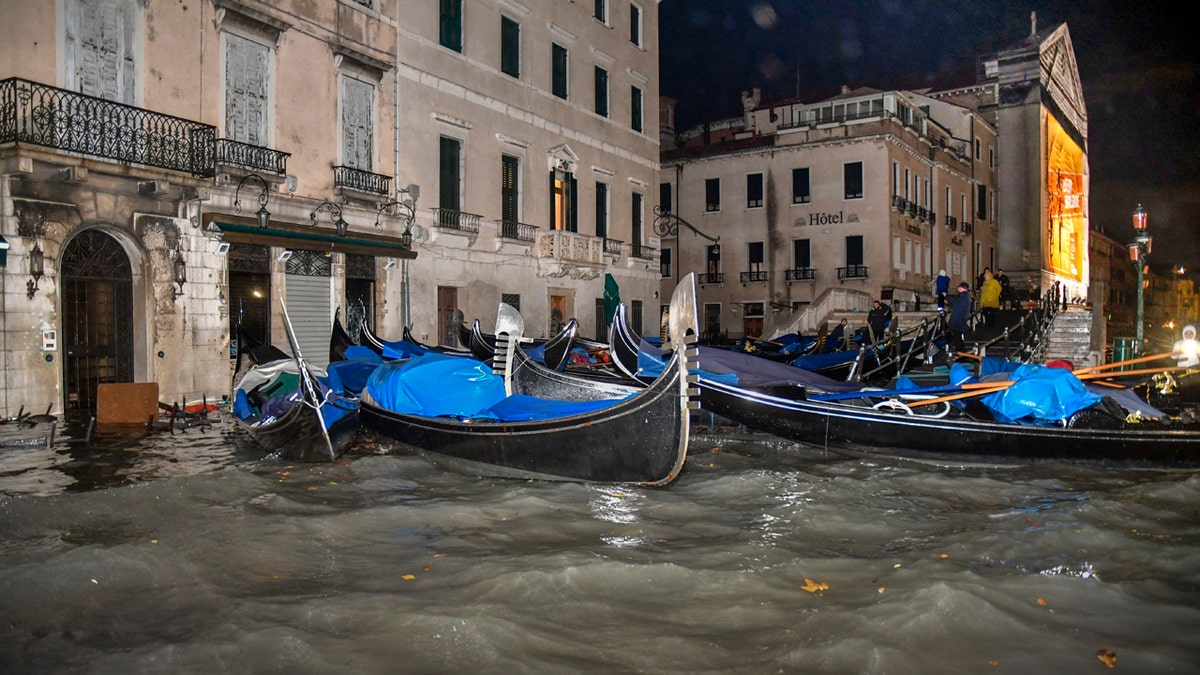 Stranded gondolas float adrift over the flooded banks, in Venice, Wednesday, Nov. 13, 2019.
