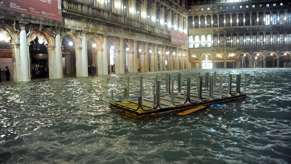 An overturned catwalk used as a walkway during high water floats in an over flooded St. Mark's Square late Tuesday, Nov. 12, 2019.