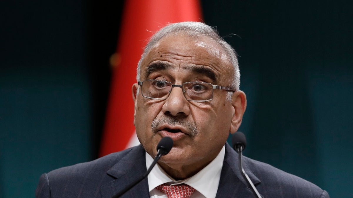 In this May 15, 2019 file photo, Iraqi Prime Minister Adel Abdul-Mahdi speaks to the media during a joint news conference with Turkish President Recep Tayyip Erdogan, in Ankara, Turkey. Abdul-Mahdi said Friday, he would submit his resignation to parliament, a day after more than 40 people were killed by security forces and following calls by Iraq's top Shiite cleric for lawmakers to withdraw support. (AP Photo/Burhan Ozbilici, File)