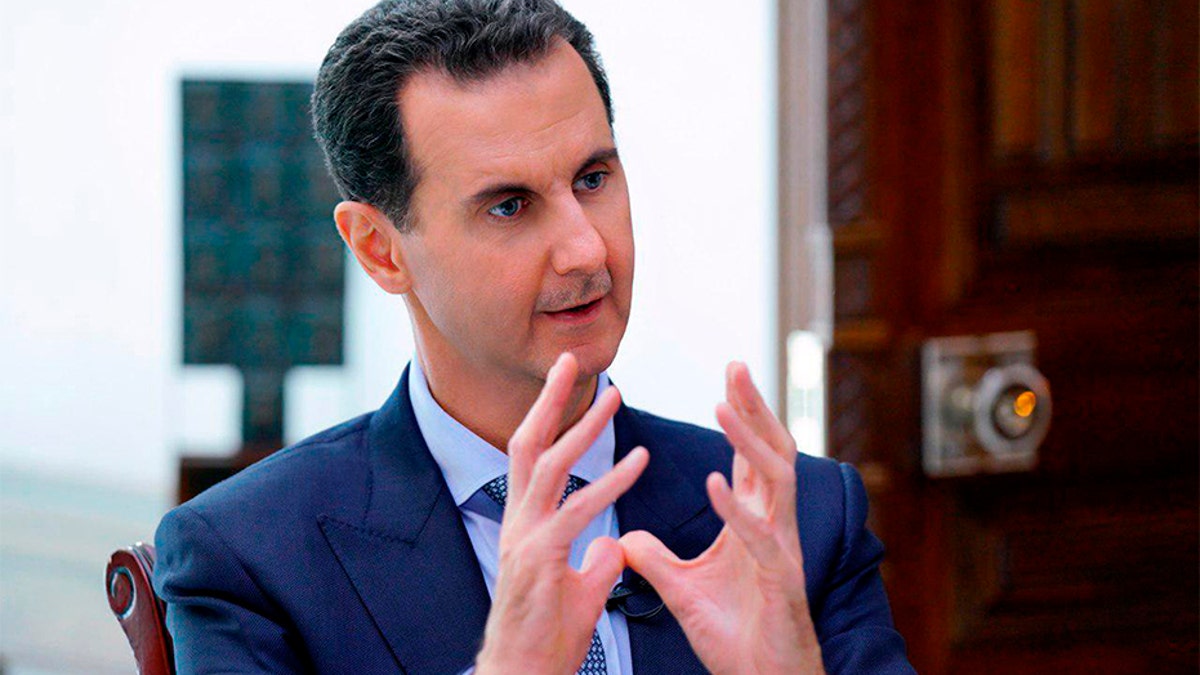 Syrian President Bashar Assad speaks during an interview in Damascus, Syria, on Friday. (AP/SANA)