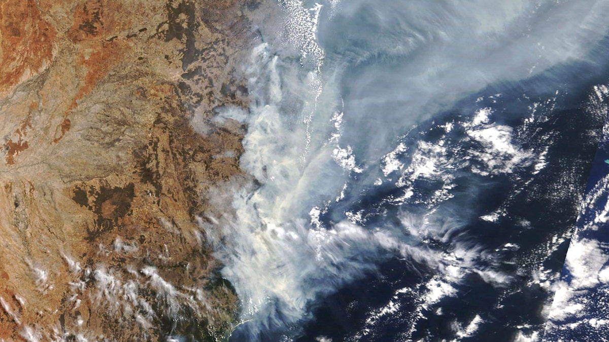 This Nov. 11, 2019, satellite photo taken by NASA shows the weather condition as bushfires burn in the eastern part of New South Wales state.