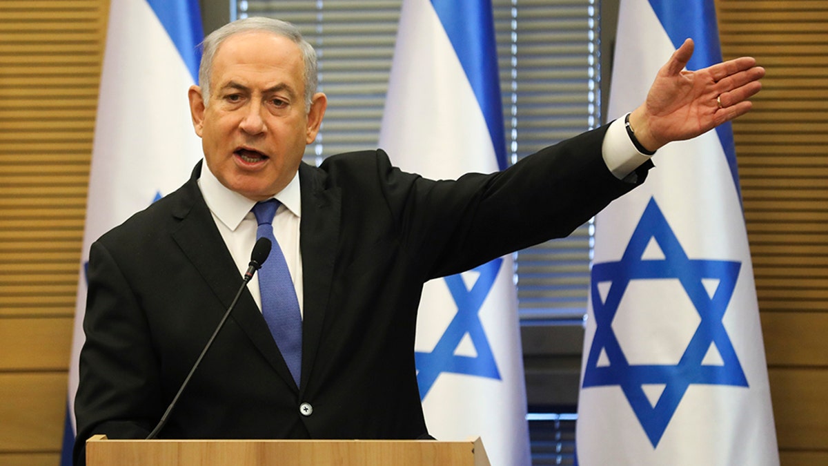 Israeli Prime Minister Benjamin Netanyahu speaks during an extended faction meeting of the right-wing bloc members at the Knesset, in Jerusalem, Wednesday, Nov. 20, 2019. (AP Photo/Oded Balilty)