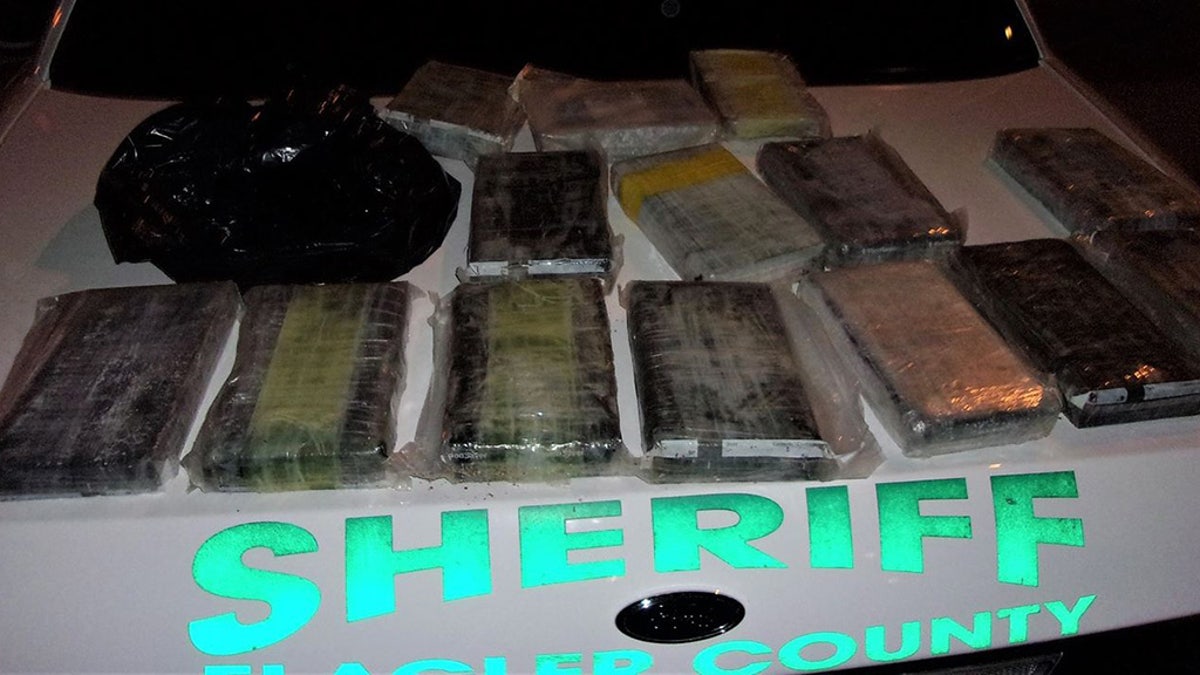 A duffel bag containing 15 kilos of cocaine was discovered Friday night after it washed ashore in Palm Coast, Fla., according to police.