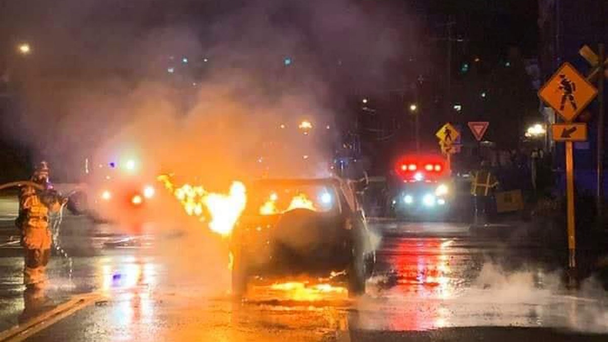 The aftermath of a car fire in Stafford, Conn., where a driver pulled over to pull a man out of the burning vehicle. 