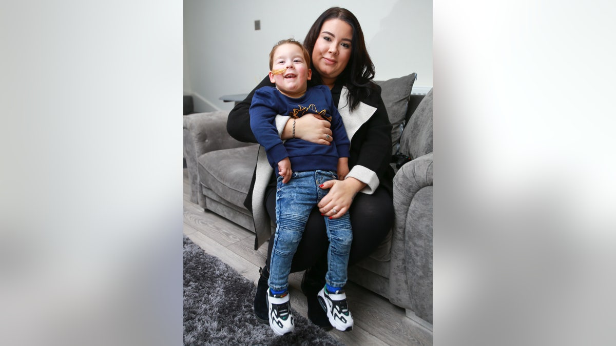 Bleu, pictured with his mother, was never expected to walk after his diagnosis. 