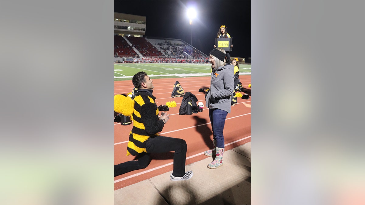 She said “yes," and the crowd went wild. The sweet moment was also witnessed by Earthman and Gutierrez’ immediate family, who had secretly gathered in the stands, according to the bride-to-be.