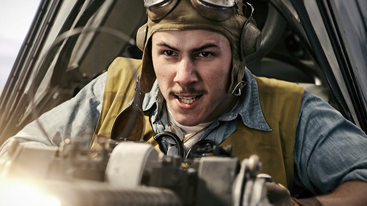 This image released by Lionsgate shows Nick Jonas in a scene from "Midway." (Reiner Bajo/Lionsgate via AP)