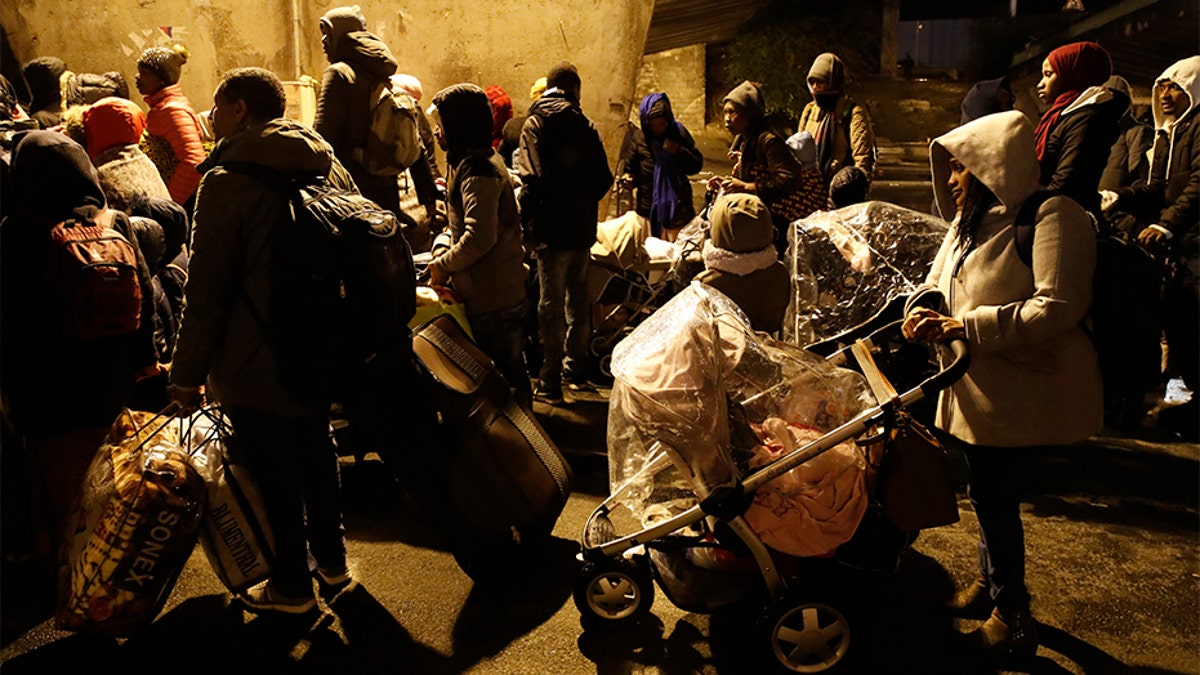 The migrants were bused away to several facilities in and around Paris Thursday after they were removed from the camps.