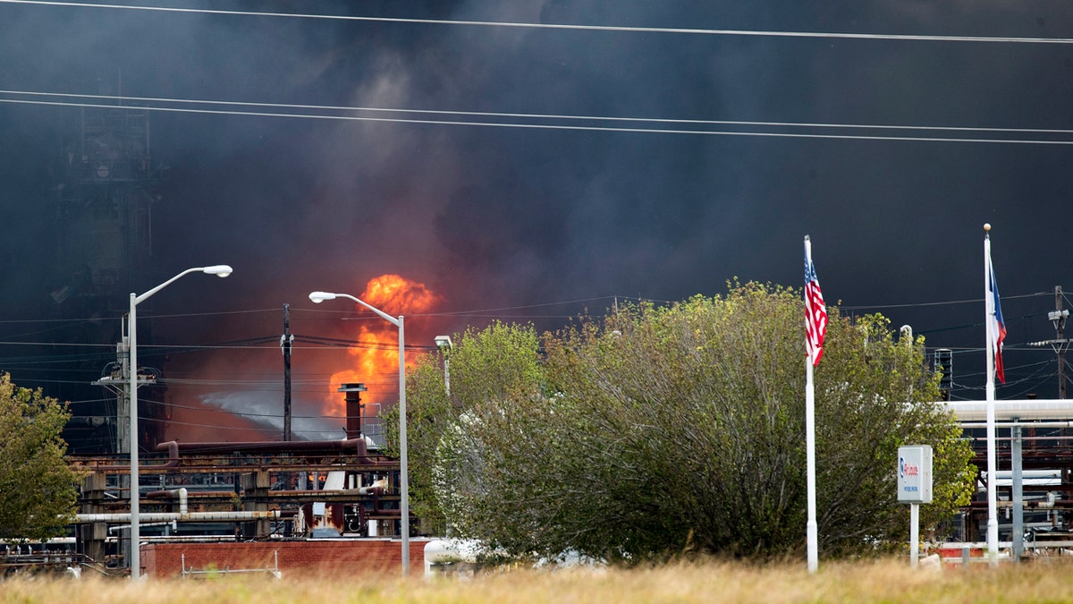 Smoke and fire are visible from the TPC Group Port Neches Operations explosion on Wednesday. (Marie D. De Jesus /Houston Chronicle via AP)