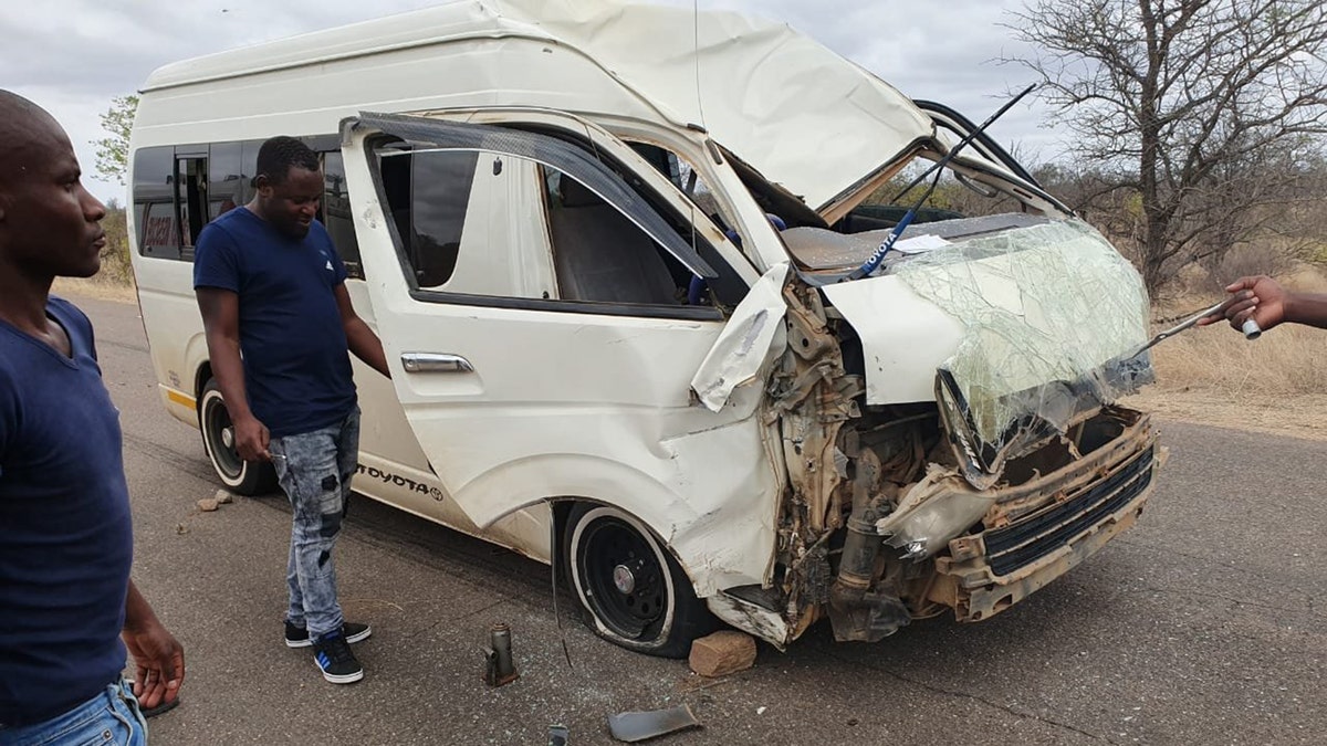 The giraffe was struck by a minibus and then sent careening into another vehicle.