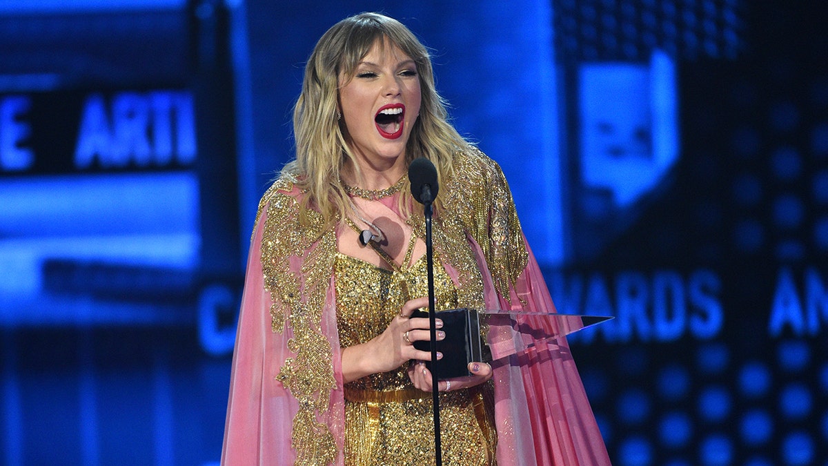 Taylor Swift accepts the award for artist of the decade at the American Music Awards on Sunday, Nov. 24, 2019, at the Microsoft Theater in Los Angeles